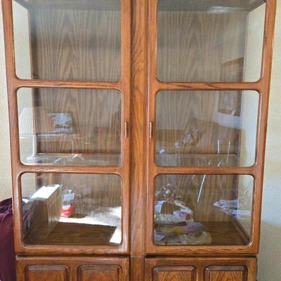 A Wooden China Cabinet With Glass Doors