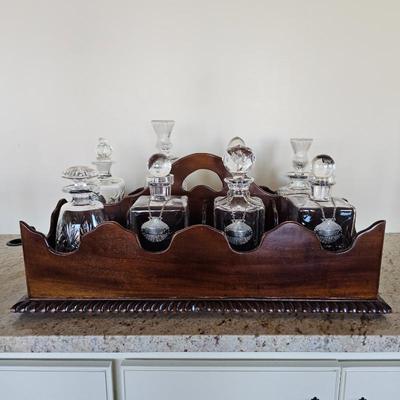 Lot #104 - Antique Georgian Mahogany 8-Bottle Carrier Caddy With 8 Crystal Glass Decanters Plus Silver Plated Shell Labels