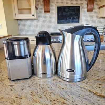 Lot #211 - Oster Electric Kettle, Thermos Coffee Pot & Cuisinart Coffee Grinder