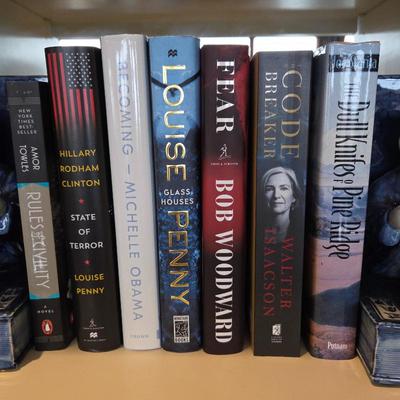 Lot #42 - Collection of Hardcover Books by Louise Penny, Michelle Obama, Bob Woodward, Walter Isaacson, Hillary Rodham Clinton