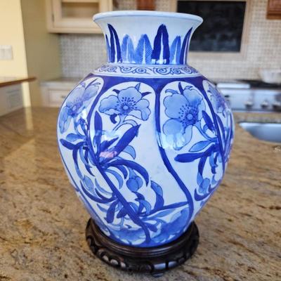 Lot #207 - Large Blue and White Chinese Floral Porcelain Vase With Carved Wood Base