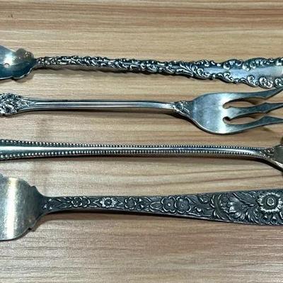 Assorted sterling serving forks