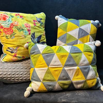 Decorative throw pillows and blanket