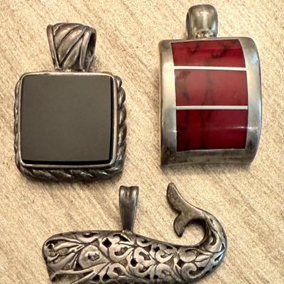 (3) Sterling Silver And Stone Pendants - Onyx, Jasper, And Pierced Whale - Weighs 28.91 Grams Total
(3) Sterling Silver And Stone...