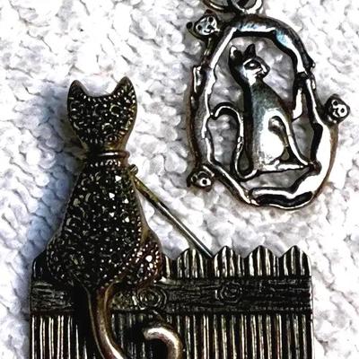 Sterling cat on a fence pin