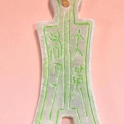 Hong kong currency or amulet pendant