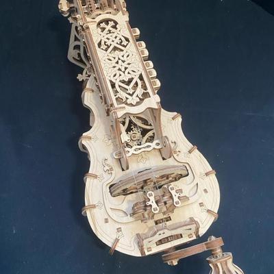 Intricate Wooden Mechanical Hurdy-Gurdy Puzzle