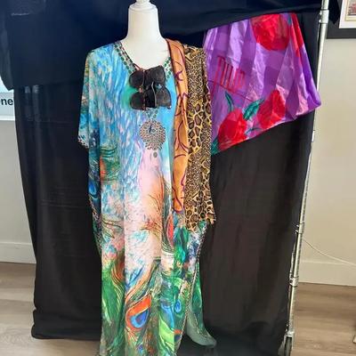 Sunglasses, Scarves, And Sheer Peacock Casual Gown