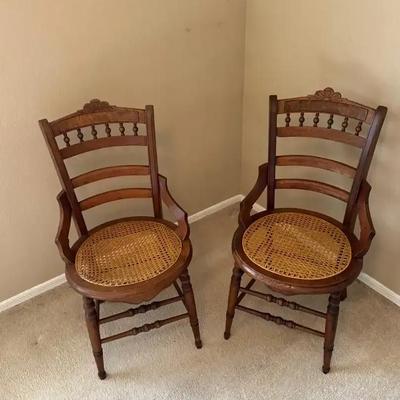 A Pair Of Vintage Wooden And Rattan Seated Chairs
