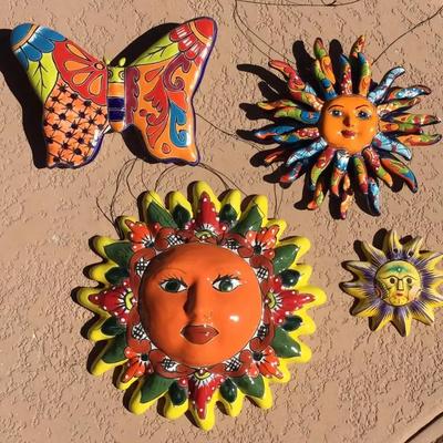 Three Mexican Ceramic Suns And One Colorful Butterfly