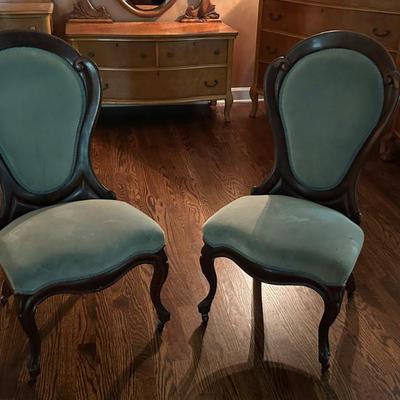 Pair of Victorian parlor chairs with solid backs.