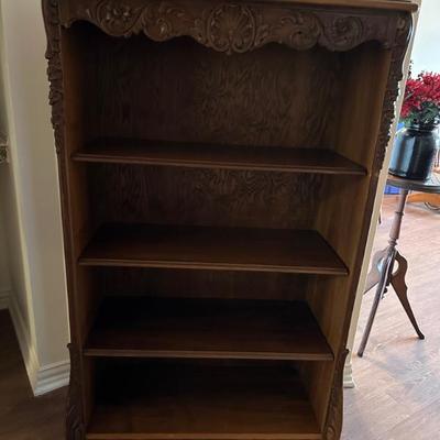 Lovely carved wood bookcase.
