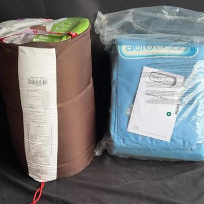 Unopened full-size air mattress and a Coleman sleeping bag