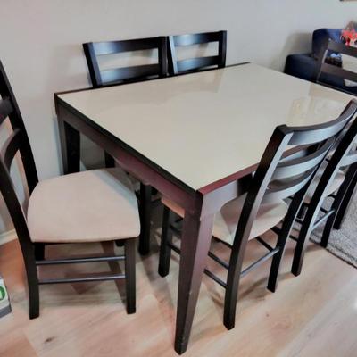 Dining table with glass top and 6 chairs. $400