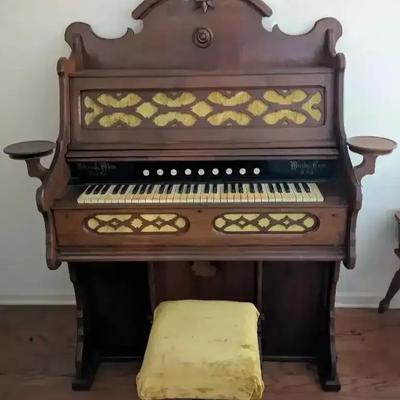 Antique Wooden Pump Organ with Ornate Detailing and Bench