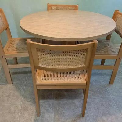 Round Laminate Dining Table with Four Cane-Seat Chairs