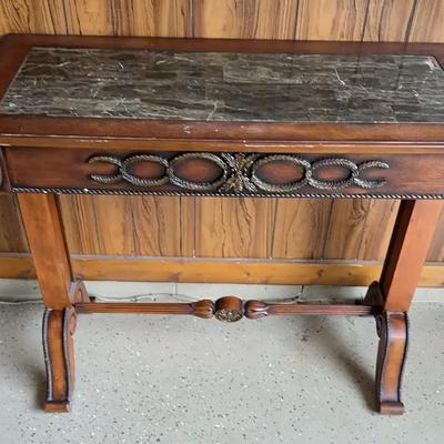 Antique hand-carved walnut console table with a marble top