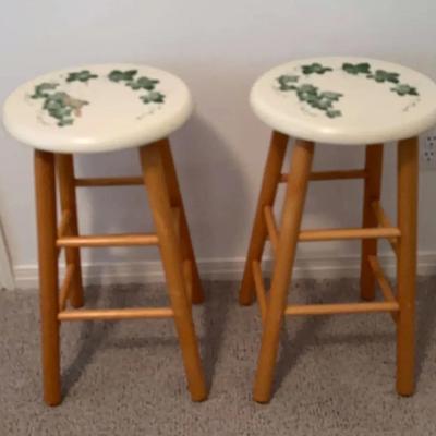 wooden bar stool with a painted Green Lead Design on the seat.