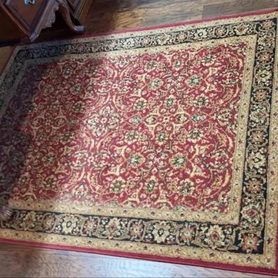 Legend Rug size 5 feet x 7 feet and the color is red/ black