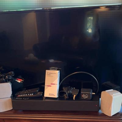  Vizio 40 Inch Tv And Sound Bar And  Cable Essentials And Three Small Speakers.
