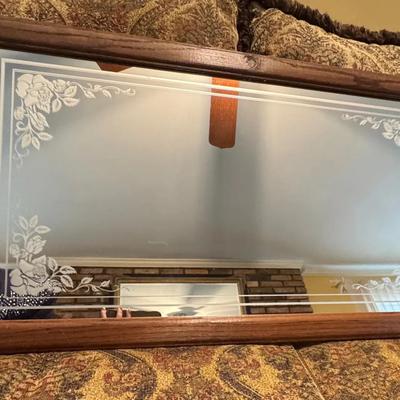 vintage wood-framed mirror with etched floral pattern