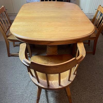 Solid Oak Dining Table w/ Pedestal Base, Built In Leaf & Four Chairs