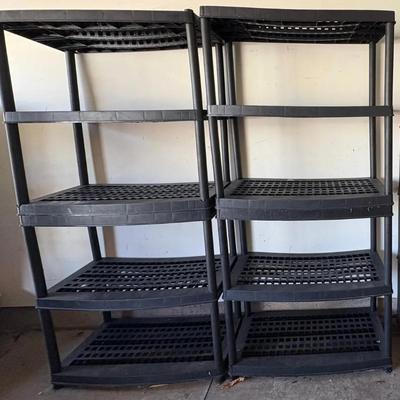 EAT327 two black plastic shelving units