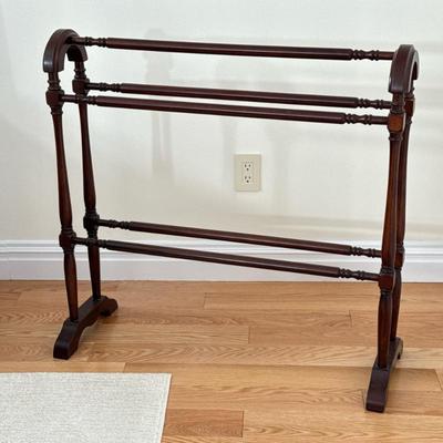 Blanket/Quilt Stand | Of dark wood with spindle racks and legs. Dimensions: h. 35 x w. 35.5 x d. 7 in
