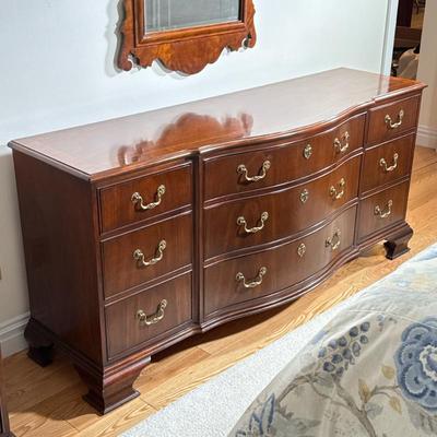 Chippendale Style Dresser By Baker Furniture | Includes a total of 9 drawers with brass handles. Center drawers have faux keyholes. Inlay...