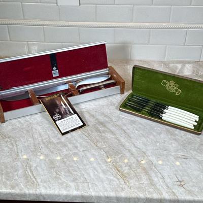 (2pc) MCM Steak Knives And Gerber Carving Set | Carving set comes with box. 6 Steak Knives with white handles are in a set by Supreme...