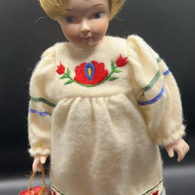 AZ694J Enesco Christmas Girl Carrying Basket of Eggs