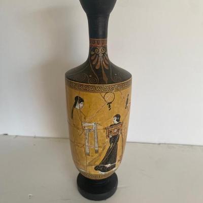 An Ancient Greek Vase, Specifically A Type Known As A Lekythos.