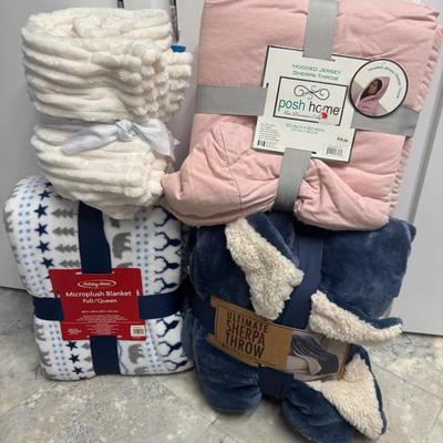 Four Brand New Plush Blankets