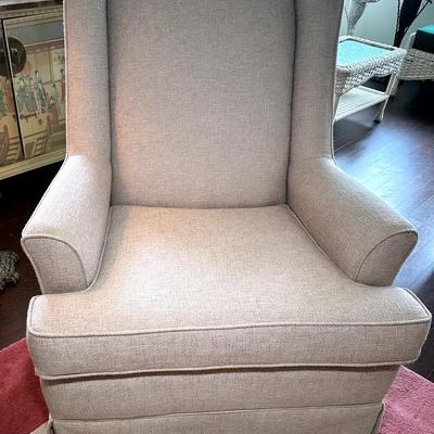 Beige Upholstered Pedestal Based Swivel Glider
