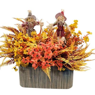 Lot #132 - Fall Themed Faux Floral Arrangement With Scarecrows & Container