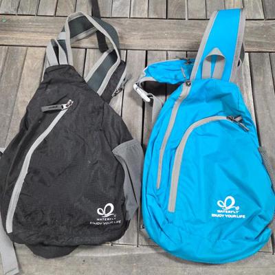 Lot #157 - Waterfly Enjoy Your Life Sling Backpacks