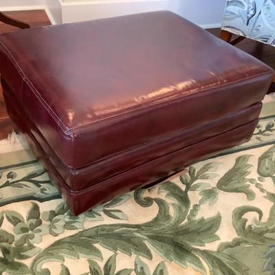 $125 leather ottoman on casters 