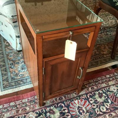 $35 side table with glass top 1 door cabinet, rack 