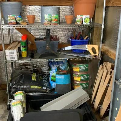 Metal Storage Shelf with Gardening Supplies and Vigoro Lawn Care Products