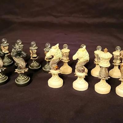 Ornate Hand-Carved Ebony and Ivory-Style Chess Pieces with Gilded Details