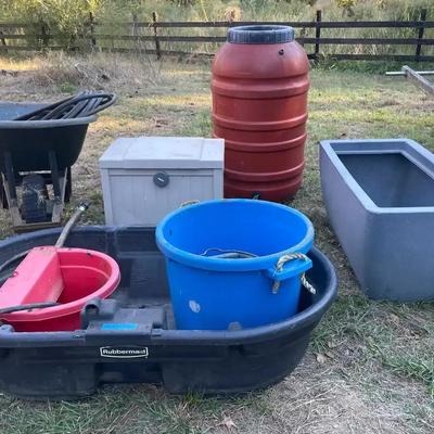 Outdoor Utility and Gardening Equipment Featuring Rubbermaid Stock Tank, Rain Barrel, and Planter