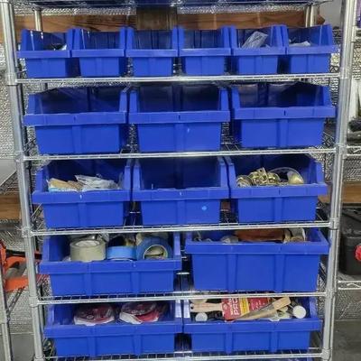 Tall Metal Organizer with Blue Storage Bins and Contents