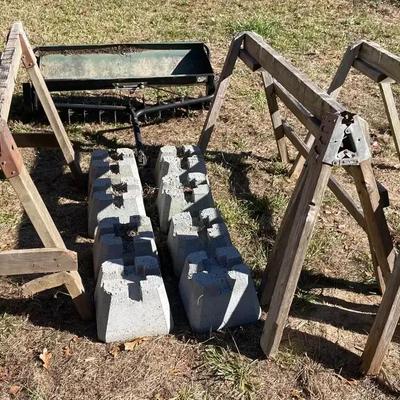 Brinly-Hardy Tow-Behind Aerator with Wooden Sawhorses and Concrete Pier Blocks