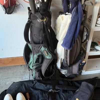 Two Sets Of Golf Clubs With Bags