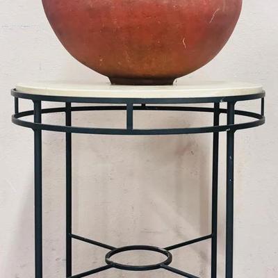 Rustic Clay Vessel on Modern Iron Side Table