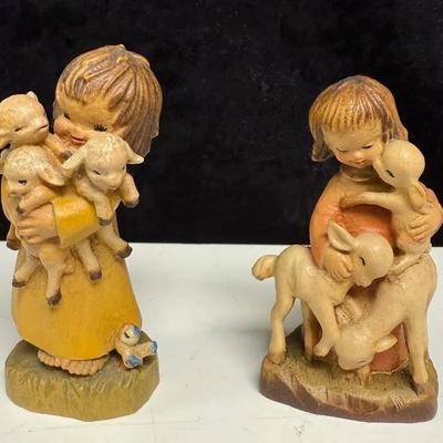 Two hand-carved wooden figurines by ANRI