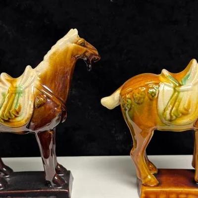 two vintage Chinese Tang Dynasty-style ceramic figurines, a horse and a camel.