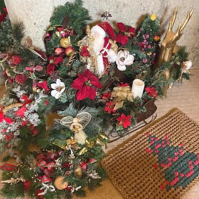 Christmas Decor With Reindeer And Bins Of Wreaths And Lights 