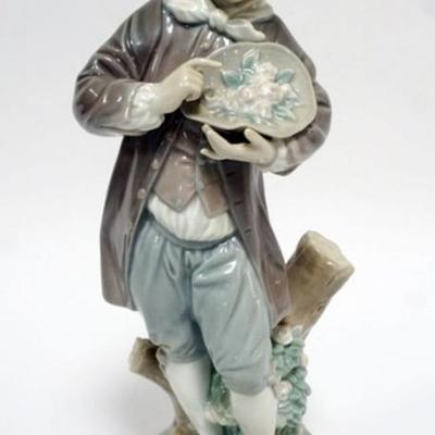 1059	LLADRO PORCELAIN FIGURE *DONCEL WITH ROSES* APPROXIMATELY 11 IN HIGH
