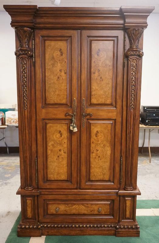 Sale Photo Thumbnail #198: 1197	DOUBLE DOOR WOOD CABINET WITH LOWER DRAWER, BURL WOOD FINISHED SIDE, DRAWER AND DOOR FRONTS AND CARVED HALF COLUMN SIDES, APPROXIMATELY 48 IN X 22 IN X 86 IN H
